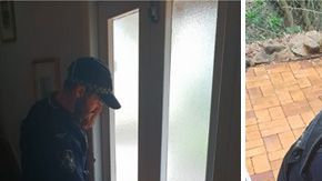 Agentes de policía ayudan a una anciana.