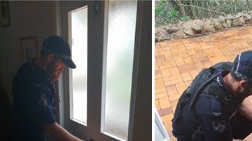 Agentes de policía ayudan a una anciana.