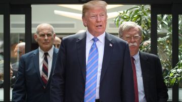 De izq. a der: John Kelly, Donald Trump y John Bolton, en una foto de 9 de junio de 2018.