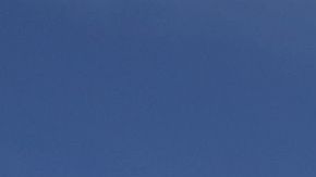 Cristina Bautista y Joaquina García posan con fotos de sus hijos, Benjamín Ascencio Bautista y Martín Getsemaní Sánchez García durante un plantón frente al Consulado de México en Los Ángeles.  (Aurelia Ventura/La Opinion)