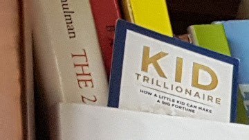 John Louzonis, el niño del dinero.