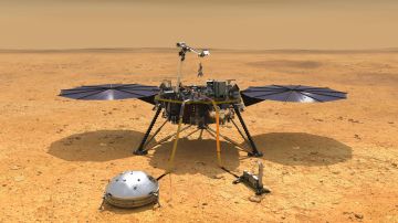 Fotografía cedida por la NASA de una ilustración que muestra una vista simulada del módulo espacial InSight mientras reduce la velocidad a medida que desciende hacia la superficie de Marte.