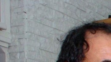 Luis Garden Acosta, fundador de El Puente, en una reunión con la congresista Nydia Velázquez, en foto de archivo de El Diario.