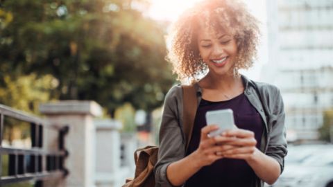 Photo of a woman using smart phone