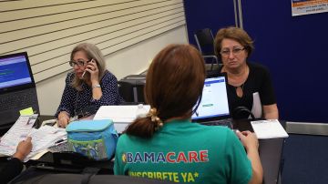 MIAMI, FL - NOVEMBER 01: Gerardina de la Mercedes (L) and Elena Blondin speak with insurance agents from Sunshine Life and Health Advisors, as they shop for insurance under the Affordable Care Act at a store setup in the Mall of Americas  on November 1, 2017 in Miami, Florida. The open enrollment period to sign up for a health plan under the Affordable Care Act started today and runs until Dec. 15.  (Photo by Joe Raedle/Getty Images)