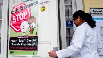 This picture taken on April 5, 2019 shows a nurse entering the Rockland County Health Department in Haverstraw, Rockland County, New York. - A measles outbreak in the area has sickened scores of people and caused the county to bar unvaccinated minors in public places. (Photo by Johannes EISELE / AFP) / With AFP Story by Catherine TRIOMPHE: NY county measles outbreak spotlights vaccine religious exemptions        (Photo credit should read JOHANNES EISELE/AFP/Getty Images)