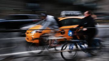 NEW YORK, NEW YORK - APRIL 02: Cars and bicyclists travel on a busy Manhattan street on April 02, 2019 in New York City. In an effort to ease traffic delays and to increase funding for public transportation, New York City has passed a plan for congestion pricing for all vehicles traveling into Manhattan south of 61st Street. While details are still being worked out, the plan will begin in December of 2020 and will include discounts for off-peak travel.  (Photo by Spencer Platt/Getty Images)