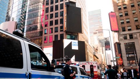 Police stand before a damaged electronic billboard on Times Square on May 18, 2019 in New York City, after briefly catching fire. - The blaze was quickly extinguished with no reported injuries and no damage to the building, officials said. (Photo by Johannes EISELE / AFP)        (Photo credit should read JOHANNES EISELE/AFP/Getty Images)