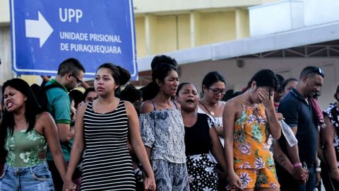 Family members of inmates are pictured praying in front of the Puraquequara Prison facility at Bela Vista community, Puraquequara neighborhood at the city of Manaus, Amazonas state on May 27, 2019. - At least 40 inmates were killed in four jails in northern Brazil on Monday, authorities said, in the latest wave of violence to rock the country's severely overpopulated and dangerous prison system. (Photo by Sandro Pereira / AFP)        (Photo credit should read SANDRO PEREIRA/AFP/Getty Images)