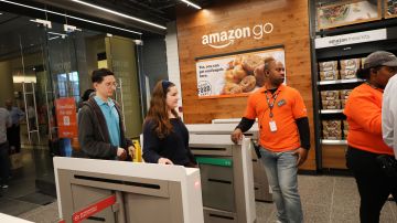 NEW YORK, NEW YORK - MAY 07: People shop at the newly opened Amazon Go Store on May 07, 2019 in New York City. The cashier-less store, the first of this type of store, called Amazon Go, accepts cash and is the 12th such store in the United States located at Brookfield Place in downtown New York. The roughly 1,300-square-foot store sells a variety of food items, prepared meals and Amazon's own meal kits. It is believed that by 2021 Amazon is considering opening up as many as 3,000 of its cashier-free stores across the United States. (Photo by Spencer Platt/Getty Images)