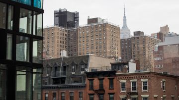 NEW YORK, NY - JANUARY 11: With the Empire State Building in the background, apartment buildings stand in the Chelsea neighborhood in Manhattan, January 11, 2018 in New York City. According to a real estate report released on Thursday, apartment rents in Manhattan fell the most in almost four years, falling around 2.7 percent from the median rent price a year ago. It was the biggest annual decline since February 2014. The median monthly rent in Manhattan now sits at $3295. (Photo by Drew Angerer/Getty Images)