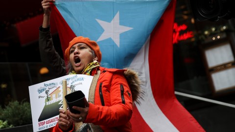 NEW YORK, NY - DECEMBER 20: Protestors rally against foreclosures on Puerto Rican families affected by Hurricane Maria, outside the offices of TPG Capital, December 20, 2017 in New York City. The activists claims that TPG Capital's mortgage service companies are aggressively foreclosing on families in Puerto Rico after many people were displaced from their homes following Hurricane Maria. (Photo by Drew Angerer/Getty Images)