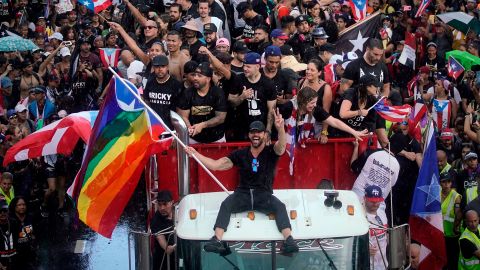 Puerto Rican singer Ricky Martin (C), alongside Puerto Rican rapper Rene Perez, aka Residente, march along Las Americas highway as they take part of a national strike demanding Puerto Rico's Governor Ricardo Rossello resignation in San Juan, Puerto Rico on, July 22, 2019. - Angry protesters blocked the main road in Puerto Rico's capital on Monday as they launched what was expected to be the largest yet of a wave of demonstrations seeking the resignation of the US territory's embattled governor. (Photo by Eric Rojas / AFP) (Photo credit should read ERIC ROJAS/AFP/Getty Images)