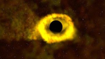 Cuando una estrella se acerca demasiado a un agujero negro, se desgarra en una corriente de gas.