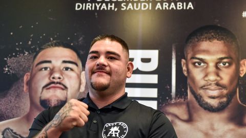 Mexican-American heavyweight boxing champion Andy Ruiz Jr poses before a poster of the upcoming "Clash on the Dunes" fight between him and British challenger Anthony Joshua, set to take place in December, at a press conference in Diriya on the western outskirts of the Saudi capital Riyadh on September 4, 2019. - The "Clash on the Dunes" is scheduled to take place in Diriya on December 7. (Photo by Fayez Nureldine / AFP) (Photo credit should read FAYEZ NURELDINE/AFP via Getty Images)