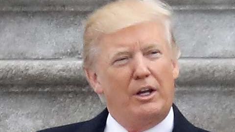 La ex primera dama Michelle Obama y Donald Trump.