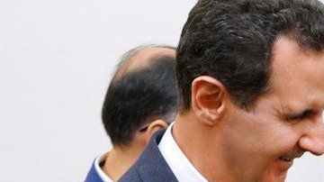 En la imagen, el presidente sirio y el líder religioso de Irán.