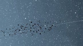 Representación artística de Júpiter y los asteroides troyanos.