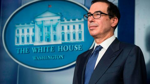 Washington (United States), 25/03/2020.- Treasury Secretary Steven Mnuchin listens as President Donald Trump delivers remarks on the COVID-19 (Coronavirus) pandemic, during a Coronavirus Task Force briefing in the Brady Press Briefing Room at the White House in Washington, DC, USA, 25 March 2020. Congress is finishing final negotiations on a two trillion dollars stimulus package, the largest in U.S history, designed to stabilize the U.S. economy and directly assist individuals in the sudden economic downturn causes by the rapidly intensifying coronavirus crisis. (Estados Unidos) EFE/EPA/SARAH SILBIGER / POOL
