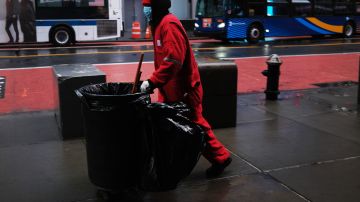 NEW YORK, NY - APRIL 13: A person cleans in a mostly desolate Times Square during the Coronavirus outbreak on April 13, 2020 in New York City. According to the World Heath Organization (WHO), the global death toll from COVID-19 has now reached over 111,000 people worldwide with many experts believing that the number is actually higher.  (Photo by Spencer Platt/Getty Images)