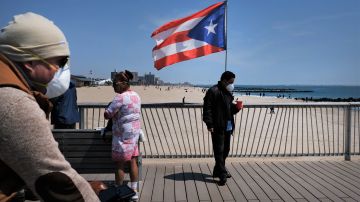 NEW YORK, NY - APRIL 25: People keep their personal distance as they enjoy a spring afternoon at Brooklyn's Coney Island on April 25, 2020 in New York City. New York City, which has been the hardest hit city in America from COVID-19, is starting to see a slowdown in hospital visits and a lowering of the daily death rate from the virus.   (Photo by Spencer Platt/Getty Images)