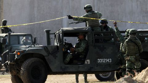 MEXICO-VIOLENCE-CRIME-MASS GRAVE
Soldiers secure the area where a clandestine mass grave was discovered at Lomas del Vergel in the community of Zapopan, Jalisco state, Mexico, on January 16, 2020. - Nearly 2,500 murders were reported between January and November in Jalisco -- a state hard-hit by violence linked to organized crime -- state authorities have said. (Photo by Ulises Ruiz / AFP) (Photo by ULISES RUIZ/AFP via Getty Images)
