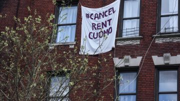 NEW YORK, NY - MAY 1:  A banner reading "Cancel rent Cuomo" hangs on a building on May 1, 2020 in the Crown Heights neighborhood in the Brooklyn borough in New York City. Tenants rights groups trying to persuade the government to halt rent and mortgage payments for as long as the economy is battered by the coronavirus.(Photo by Stephanie Keith/Getty Images)