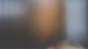 woman-with-brown-hair-doing-lipstick-and-holding-little-6393