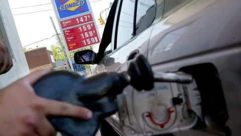 NORTH BERGEN - MAY 19: Francisco Veloz pumps gas at a Sunoco station May 19, 2003 in North Bergen, New Jersey. Gasoline prices have dropped more than 2 cents a gallon as crude oil prices have fallen after the U.S.-led victory in the Iraq war. The Conference Board's index of leading economic indicators showed slow growth in the U.S. for the month of April. Stocks were down sharply today. (Photo by Chris Hondros/Getty Images)
