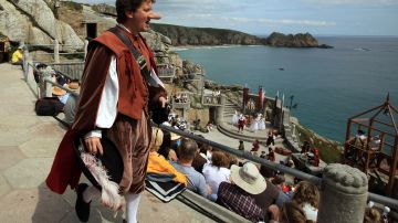 PORTHCURNO, UNITED KINGDOM - AUGUST 05:  Members of the Shattered Windscreen Theatre Company perform Cyrano De Bergerac at the Minack Theatre on August 5, 2011 in Porthcurno, England. The play is one of a number of week long productions being hosted at the World famous open-air theatre throughout the summer. The theatre, built by Rowena Cade in the 1930s and carved into the granite cliffs above the sea at Porthcurno, attracts around 75,000 theatre-goers every summer to watch summer performances - ranging from Shakespeare to musicals which are held from May until September, although the grounds and exhibition centre are open all year.  (Photo by Matt Cardy/Getty Images)