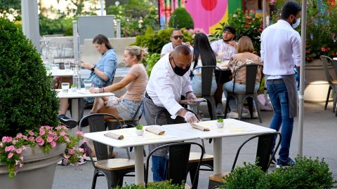 NEW YORK - JULY 27: An outdoor dining area is seen as the city continues Phase 4 of re-opening following restrictions imposed to slow the spread of coronavirus on July 27, 2020 in New York City. Many restaurants have built outdoor seating on the streets in order to allow for social distancing between patrons. The fourth phase allows outdoor arts and entertainment, sporting events without fans and media production. (Photo by Jamie McCarthy/Getty Images)