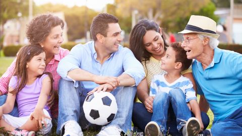 Multi Generation Family Playing Soccer Together