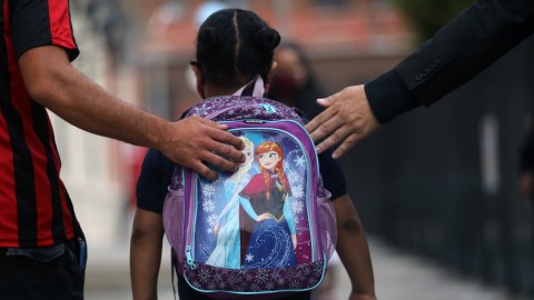 NEW YORK, NEW YORK - SEPTEMBER 29: Elementary school students are welcomed back to P.S. 188 as the city's public schools open for in-person learning on September 29, 2020 in New York City. Middle and high schoolers will start on Oct. 1 while Pre-K students and students with disabilities could return to school starting on Sept. 21. On Sunday, the executive board of the union representing more than 6,400 of New York City's school leaders passed a unanimous vote of no confidence against Mayor Bill de Blasio and Schools Chancellor Richard Carranza for what they called a failure to lead New York City through the safe and successful reopening of its schools.  (Photo by Spencer Platt/Getty Images)