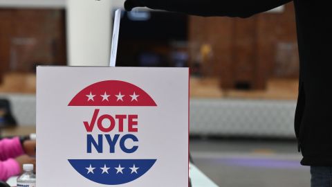 A voter drops off her early voting ballot for the 2020 Presidential election at the Brooklyn Museum in New York City on October 30, 2020. - Reportedly, the school is the busiest polling station in the city where voters, in some cases, wait up to six hours to cast their ballots. (Photo by Angela Weiss / AFP) (Photo by ANGELA WEISS/AFP via Getty Images)