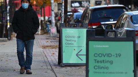 A man walks past a Covid-19 testing site on December 1, 2020 in New York City. - The United States is the worst-affected country with COVID-19, with more than 267,000 Covid-19 deaths, and the Trump administration has issued conflicting messages on mask-wearing, travel and the danger posed by the virus. (Photo by Angela Weiss / AFP) (Photo by ANGELA WEISS/AFP via Getty Images)