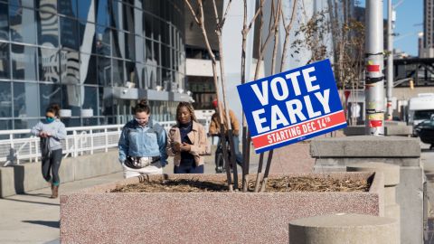 ATLANTA, GA - DECEMBER 14: Early voters stand in line at the State Farm Arena on December 14, 2020 in Atlanta, Georgia. Early voting started today in Georgia for the runoff Election for Georgia Senators between Republican incumbents David Perdue and Kelly Loeffler and Democratic candidates John Ossoff and Raphael Warnock. (Photo by Megan Varner/Getty Images)