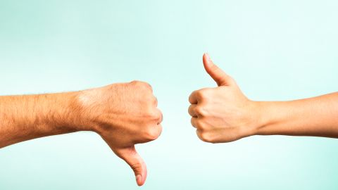 Two,Hands,Signalling,Thumbs,Up,And,Thumbs,Down.,The,Smooth