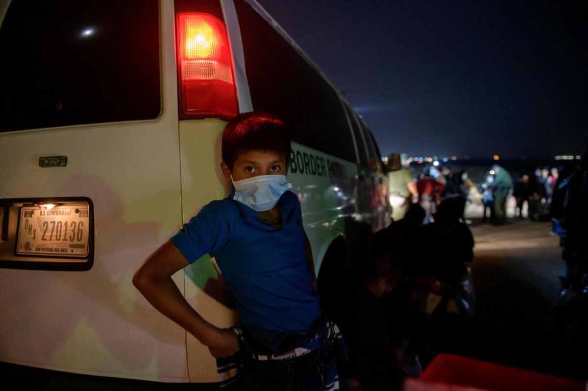 Hundreds of migrant children arrive at the convention center in San Diego