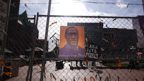 MINNEAPOLIS, MINNESOTA - MARCH 30: A picture of George Floyd hangs on a fence barrier that surrounds the Hennepin County Government Center as the trial of former Minneapolis police officer Derek Chauvin continues on March 30, 2021 in Minneapolis, Minnesota. Chauvin is accused of murder in the death of George Floyd. Security is heightened in the city in an effort to prevent a repeat of violence that occurred in Minneapolis and major cities around the world following Floyd's death on May 25, 2020.  (Photo by Scott Olson/Getty Images)