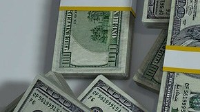 Fajos de billetes de dólares.