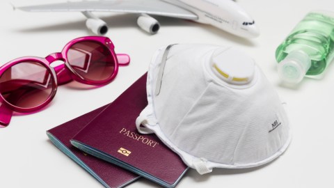 Travelling,During,The,Coronavirus,Outbreak.,Passport,With,Face,Mask,,Sunglasses