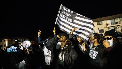 Demonstrators shout slogans as they gather during the seventh night of protests over the shooting death of Daunte Wright by a police officer in Brooklyn Center, Minnesota on April 17, 2021. - Police officer, Kim Potter, who shot dead Black 20-year-old Daunte Wright in a Minneapolis suburb after appearing to mistake her gun for her Taser was arrested April 14 on manslaughter charges. (Photo by CHANDAN KHANNA / AFP) (Photo by CHANDAN KHANNA/AFP via Getty Images)