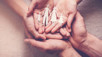 Hands,Holding,Paper,Family,Cutout,,Family,Home,adoption,foster,Care,,Homeless,Charity,