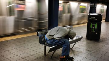 NEW YORK, NEW YORK - MAY 06: A homeless man sleeps in an empty station as workers close down the New York City subway system, the largest public transportation system in the nation, for nightly cleaning due to the continued spread of the coronavirus on May 06, 2020 in New York City. Following reports of homeless New Yorkers sleeping on the trains and the deaths of numerous subway employees, the Metropolitan Transportation Authority has decided to close New York’s subway system from 1am to 5am every evening for a deep cleaning. New York continues to be the national center of the COVID-19 outbreak. (Photo by Spencer Platt/Getty Images)