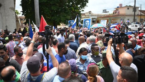 Cuban President Miguel Diaz-Canel (C) is seen during a demonstration held by citizens to demand improvements in the country, in San Antonio de los Banos, Cuba, on July 11, 2021. - Thousands of Cubans marched this Sunday, July 11, through the streets of the small town of San Antonio de los Banos in an unprecedented protest against the government, according to videos of fans posted on the internet. (Photo by Yamil LAGE / AFP) (Photo by YAMIL LAGE/AFP via Getty Images)