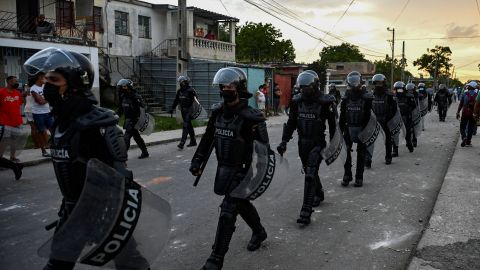 TOPSHOT - Riot police walk the streets after a demonstration against the government of President Miguel Diaz-Canel in Arroyo Naranjo Municipality, Havana on July 12, 2021. - Cuba on Monday blamed a "policy of economic suffocation" of United States for unprecedented anti-government protests, as President Joe Biden backed calls to end "decades of repression" on the communist island. Thousands of Cubans participated in Sunday's demonstrations, chanting "Down with the dictatorship," as President Miguel Díaz-Canel urged supporters to confront the protesters. (Photo by YAMIL LAGE / AFP) (Photo by YAMIL LAGE/AFP via Getty Images)