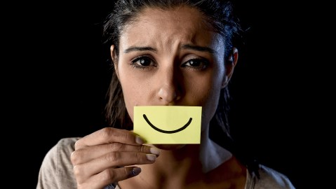 Young,Beautiful,Latin,Sad,And,Depressed,Latin,Girl,Holding,Paper