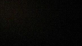 A wedding cake featuring two grooms and