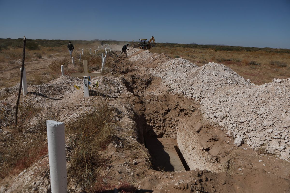 Forensics unearth coffins of people not identified or claimed by their relatives, in the common grave of the San Rafael Municipal Pantheon in Ciudad Juárez, Mexico.