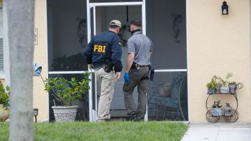 NORTH PORT, FL - SEPTEMBER 20: FBI agents collect evidence from the home of Brian Laundrie, who is a person of interest after his fiancé Gabby Petito went missing on September 20, 2021 in North Port, Florida. A body has been found by authorities in Wyoming that fits the description of Petito, who went missing while on a cross country trip with Laundrie. (Photo by Octavio Jones/Getty Images)